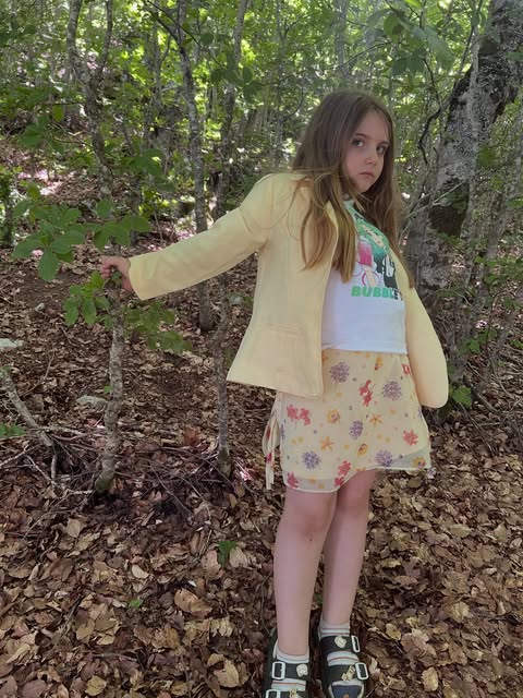 Eva wearing yellow in woodland